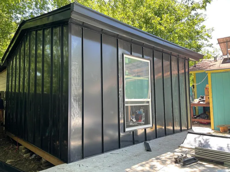 Black standing seam metal wall panels for Roof Inspection in Milan